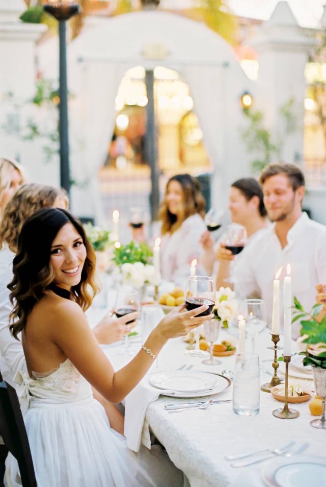 Closeup of Guest Table with Female Smiling at Romantic Riviera