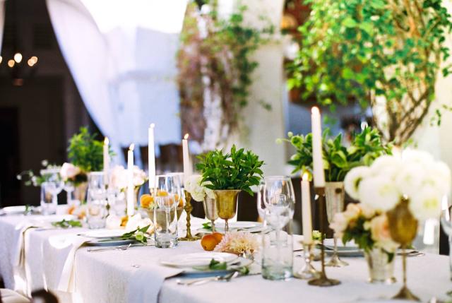 Closeup of Guest Table with Flowers, Fruit, Candles and Placemats at Romantic Riviera