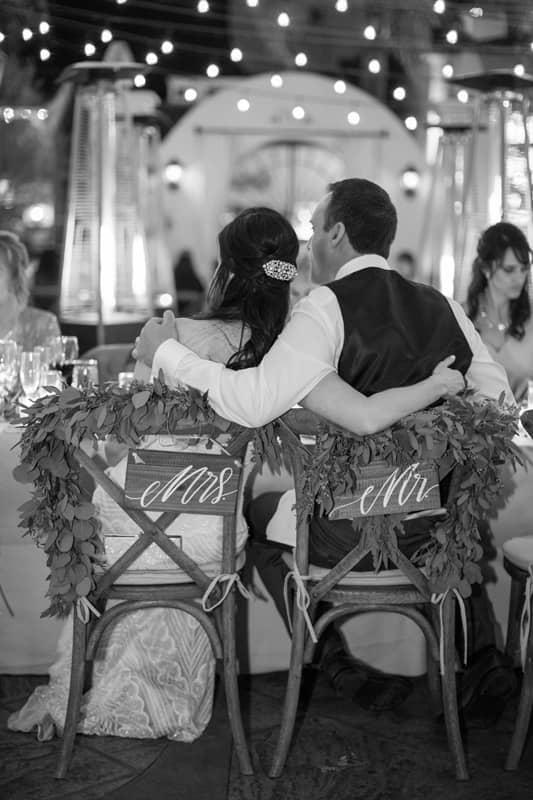 Black & White Back View of Bride & Groom on Chairs for Kelly & Jason’s Wedding