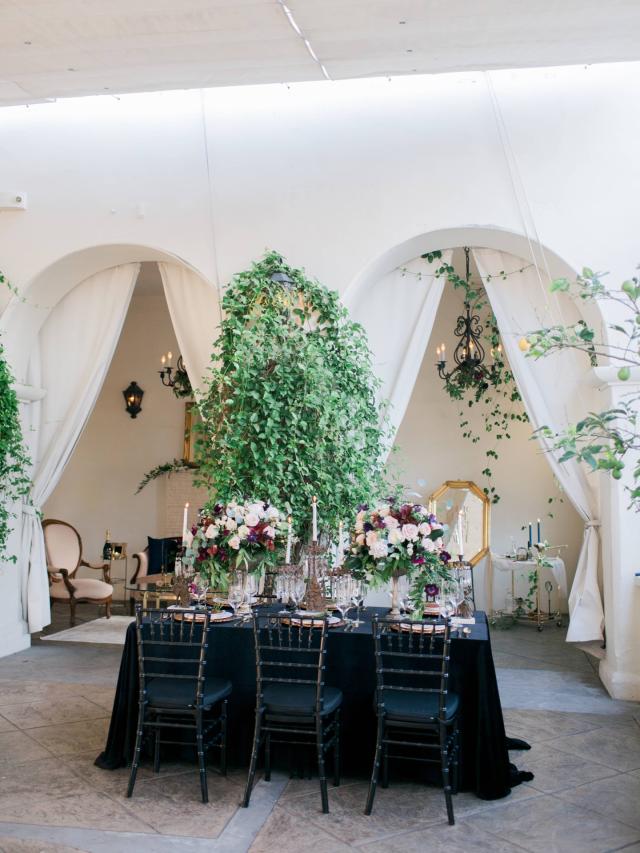 Black Dining Table with Flowers, Candles & Chairs for Spanish Nights