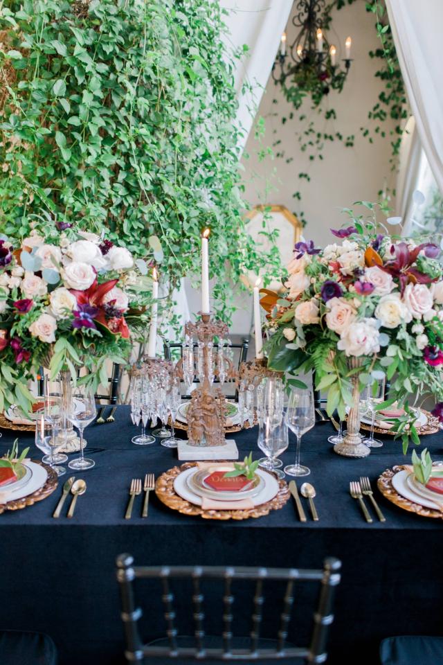 Closeup of Table with Flowers, Gold Plates & Cutlery, Flowers & Candles for Spanish Nights 