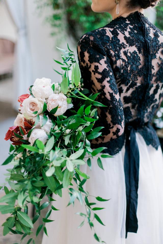 Lady from Behind Holding Flowers for Spanish Nights