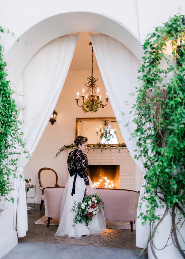 Lady Holding Flowers in Front of Fireplace for Spanish Nights