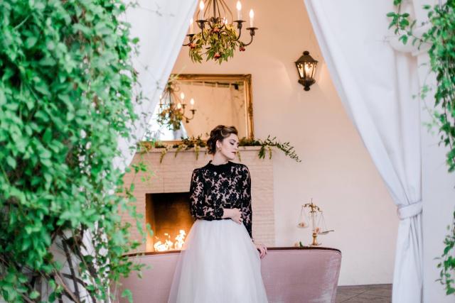 Lady in Front of Fireplace Surrounded by Vines for Spanish Nights