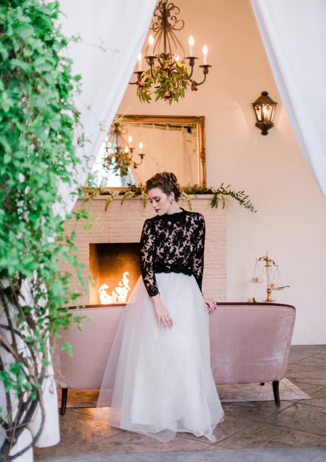 Lady Looking Down in Front of Fireplace Surrounded by Vines for Spanish Nights