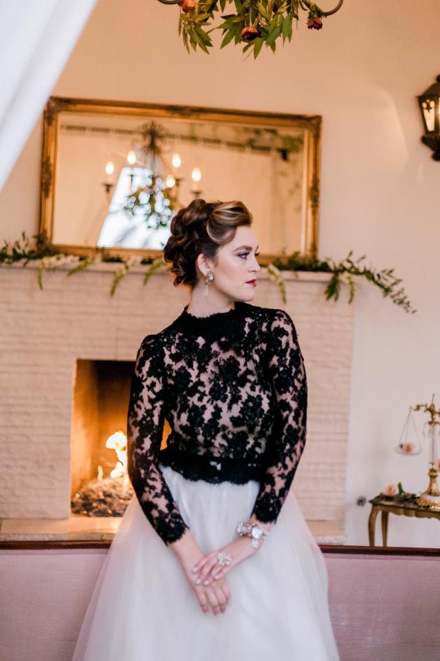 Midshot Lady Looking Away in Front of Fireplace Surrounded by Vines for Spanish Nights