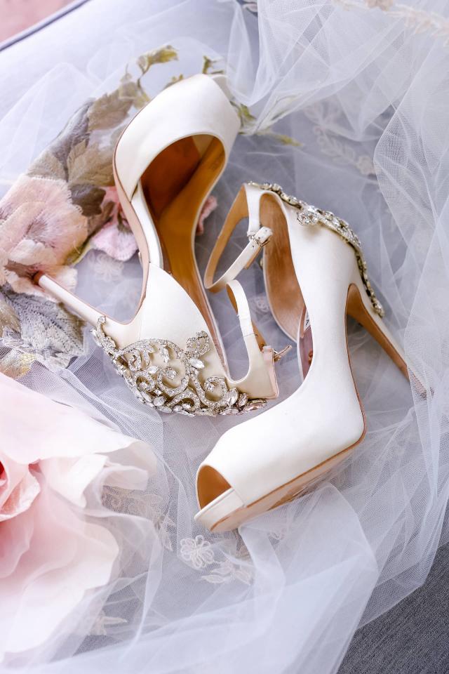 Closeup of Bride's Shoes Laying Down at Rhiannon & Joshua's Wedding