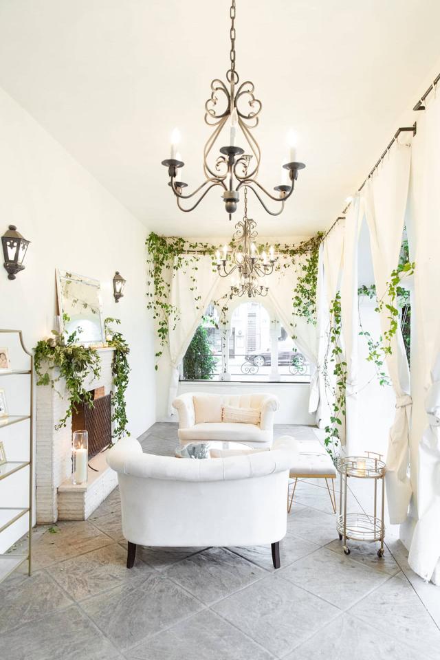 White Furniture on Patio with Vines at Angela & Kevin's Wedding