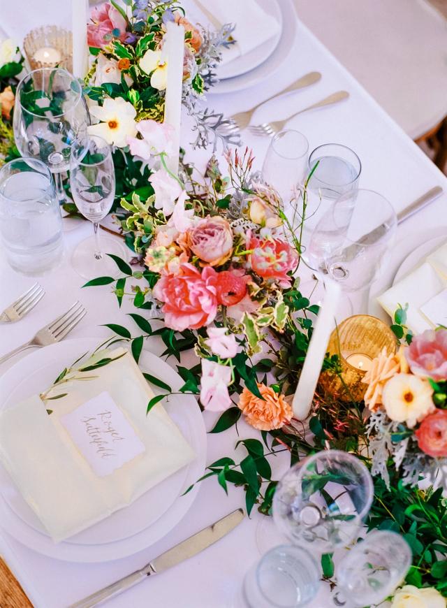 Overview of Guest Table with Flower Arrangement at Rhiannon & Joshua's Wedding