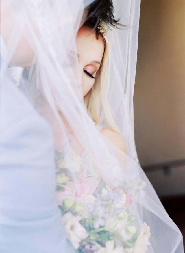 Closeup of Bride Wrapped in Bridal Veil at Rhiannon & Joshua's Wedding