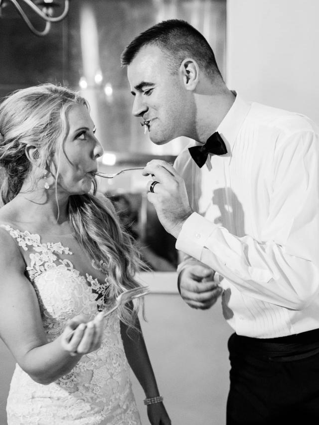Bride & Groom Feeding Each Other at Stephanie & Grant's Wedding