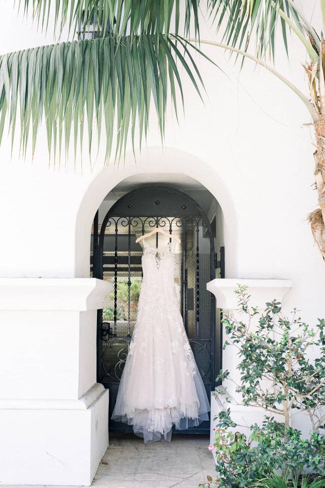 Bridal Dress Hanging in Alcove at Stephanie & Grant's Wedding