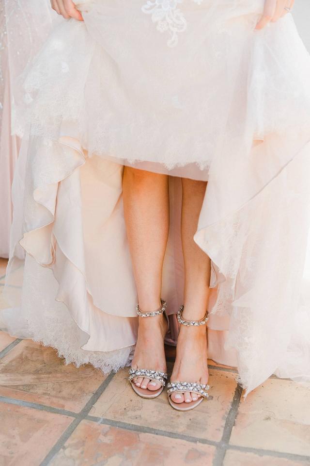 Bride Showing off Shoes at Stephanie & Grant's Wedding