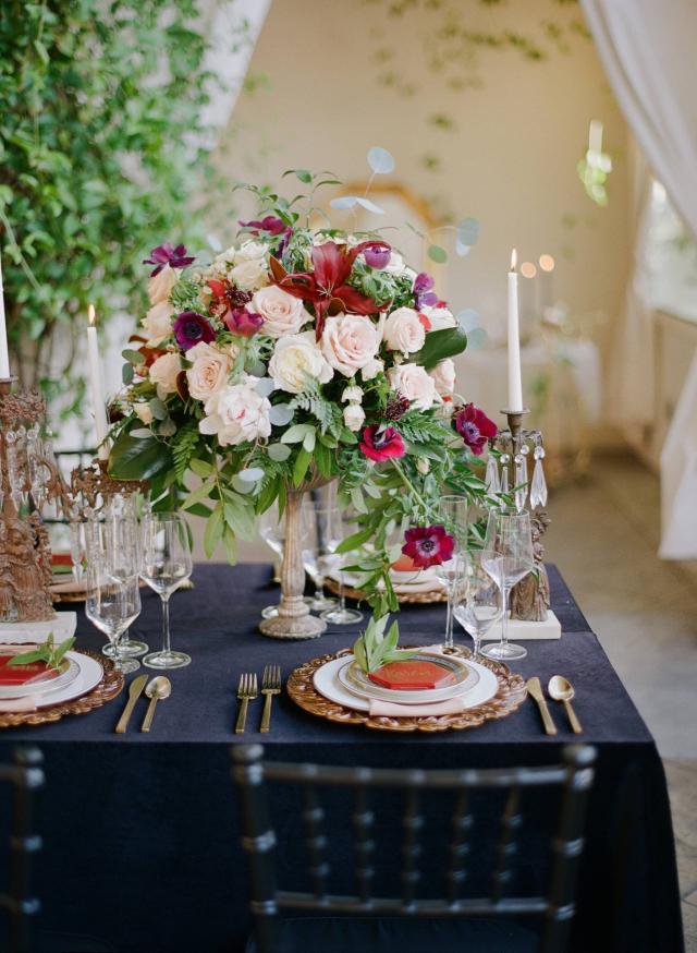 Closeup of Flowers & Placemat on Black Table & Candle for Spanish Nights