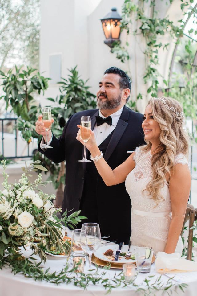 Bride & Groom Holding a Glass of Champaign at Evelyn & Gus' Wedding