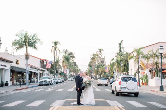 Couple Kissing on City Backdrop for Karen & Andy’s Wedding