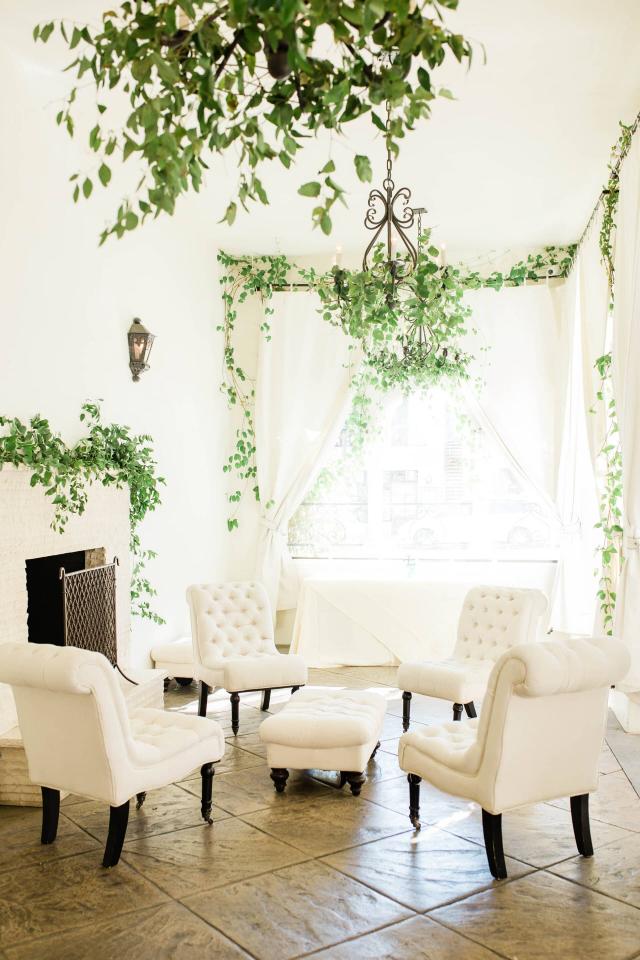 Vertical View of White Furniture on Patio at Evelyn & Gus' Wedding
