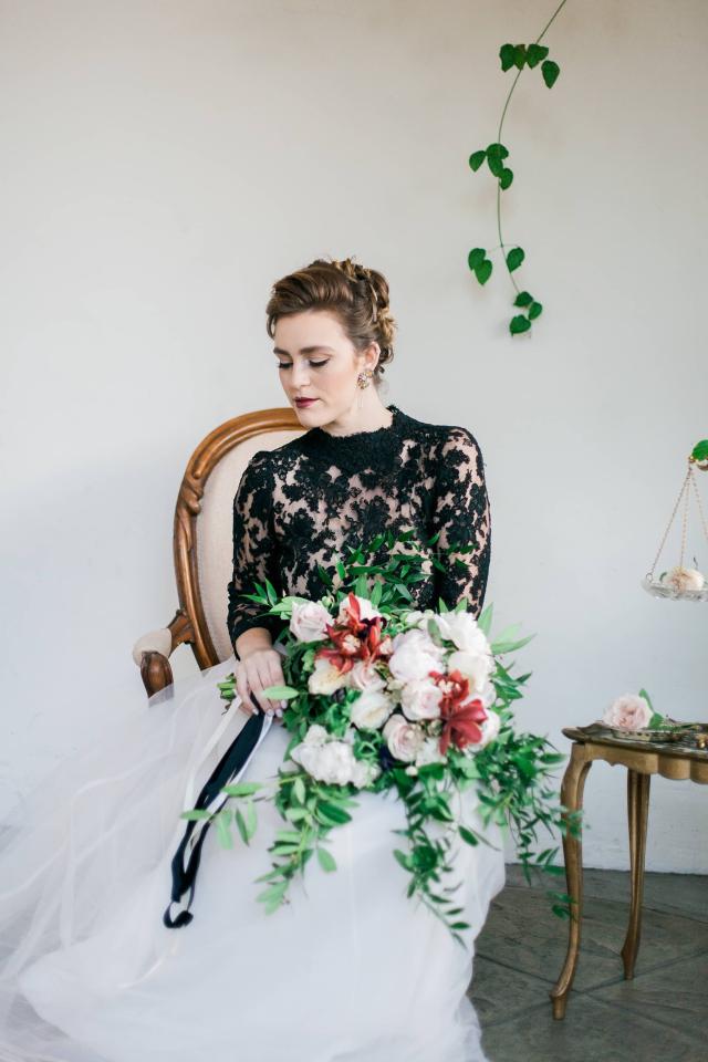 Closeup of Lady Sitting on Chair with Bouquet In Hands for Spanish Nights