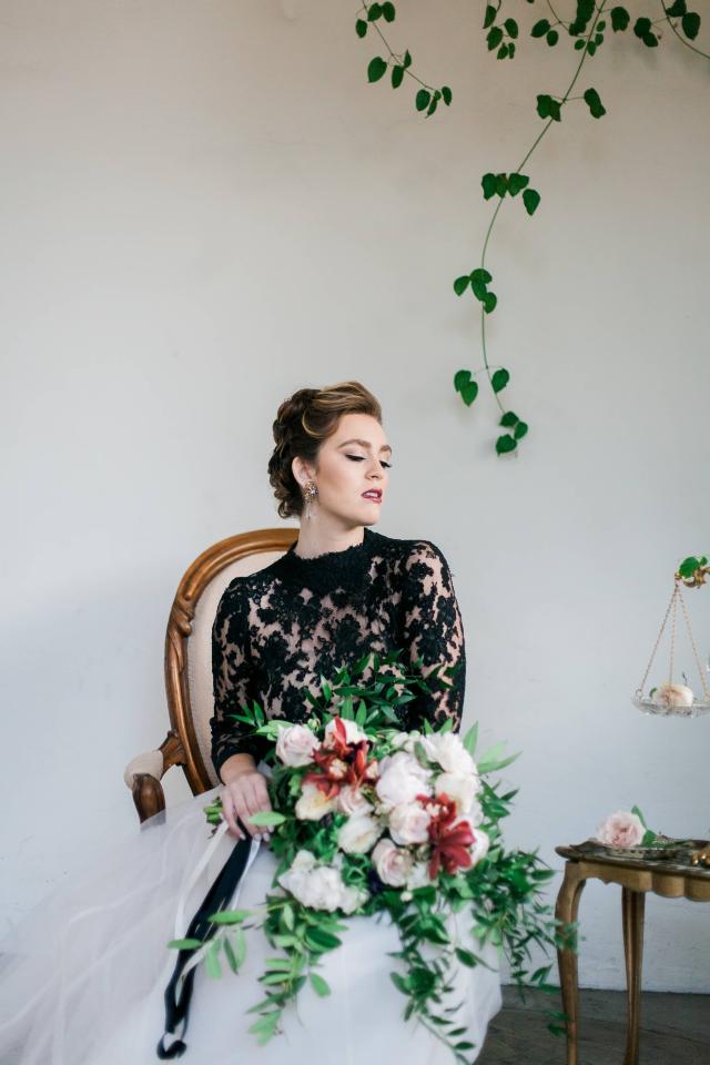 Closeup of Lady Sitting on Chair, looking Away with Bouquet In Hands for Spanish Nights
