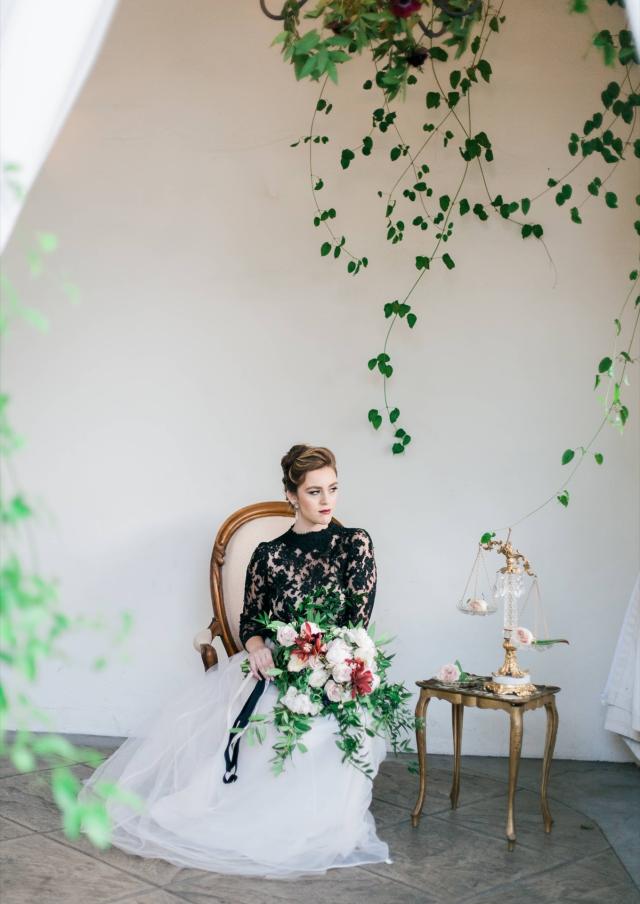 Midshot Lady Sitting on Chair with Bouquet In Hands for Spanish Nights