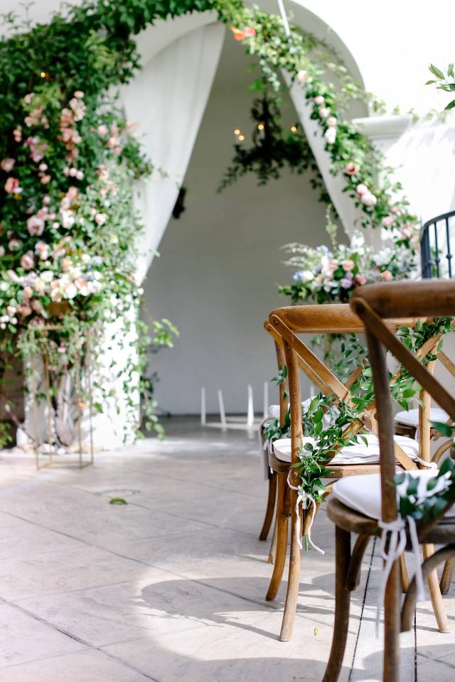 Chairs with Vine Flower Arrangement at Rhiannon & Joshua's Wedding