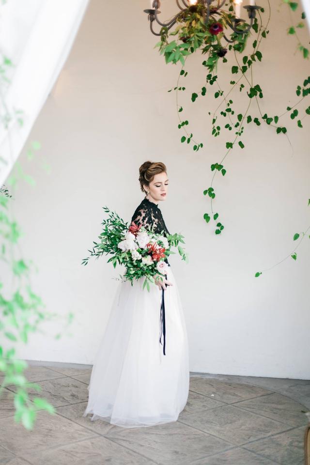 Lady Sideways with Head Up & Eyes Down Holding Flowers for Spanish Nights