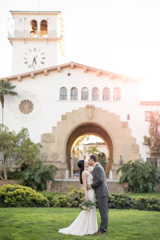 Bride & Groom Kissing Inside Archway for Kelly & Jason’s Wedding