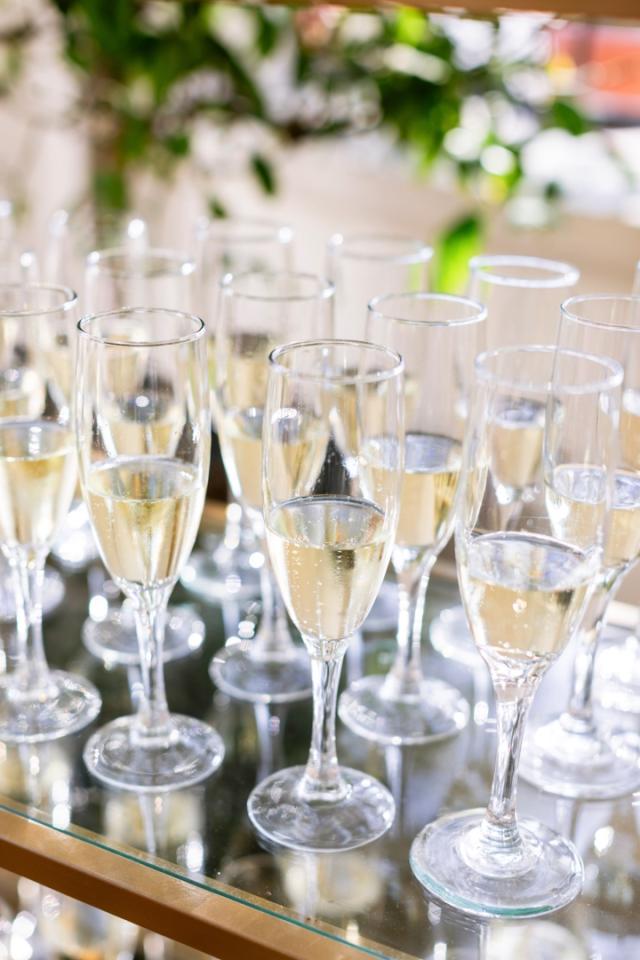Close up of filled champagne glasses for Danielle & Richard's Wedding