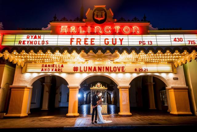 Outside view of the Arlington Theatre with couple under archway for Daniella & Karl's Wedding