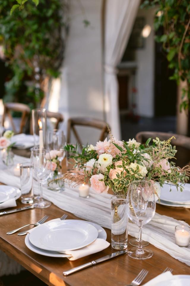 Side view of table with flower arrangement for Danielle & Richard's Wedding