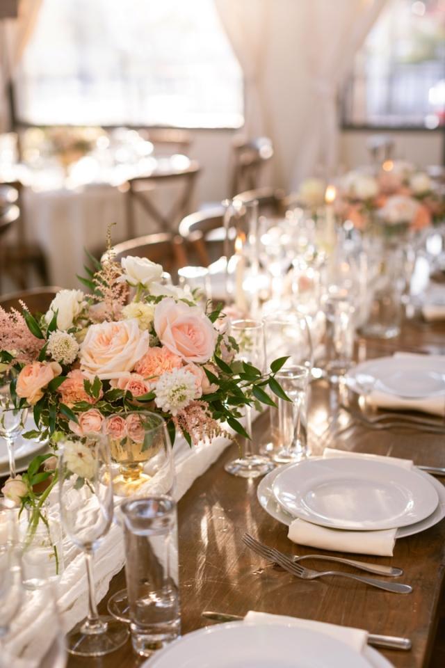 Side view of multiple place sets and flowers for Danielle & Richard's Wedding