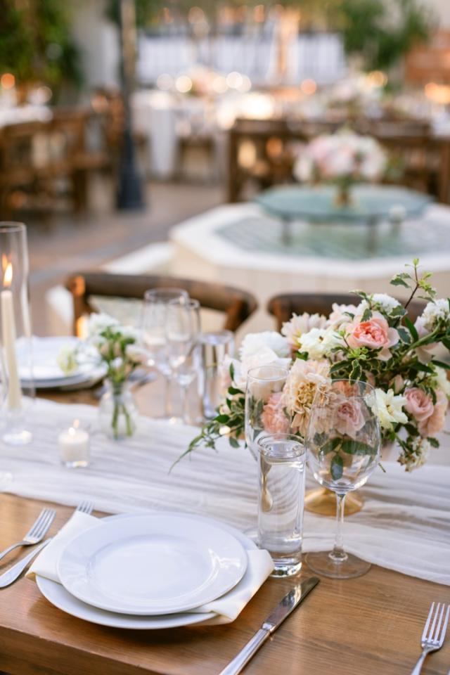 Single place set with central flower arrangement in background for Danielle & Richard's Wedding