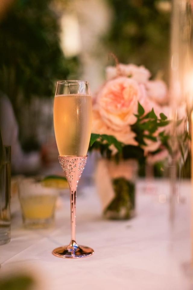 Chapagne glass filled with flower arrangement for Danielle & Richard's Wedding