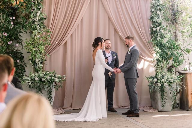 Left view of Bride and groom with wedding officiant for Danielle & Michael's Wedding