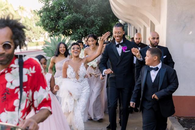 Bridal party walking down the street for Daniella & Karl's Wedding