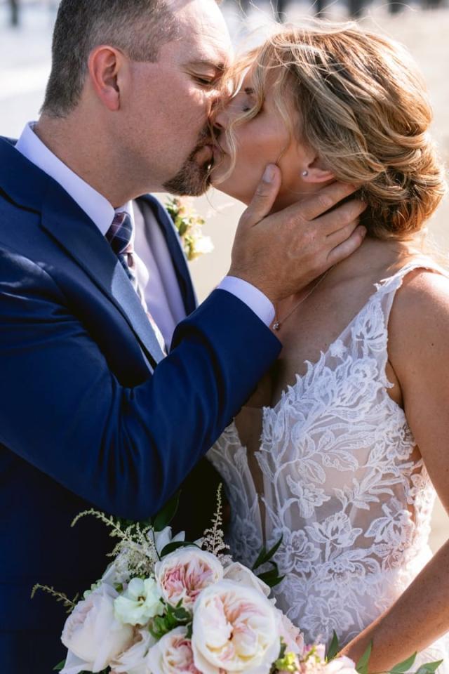 Bride and groom kissing outside for Danielle & Richard's Wedding