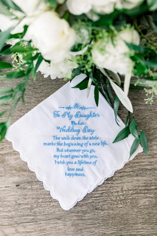 Poem on wooden table with flowers for Sara & James’s Wedding