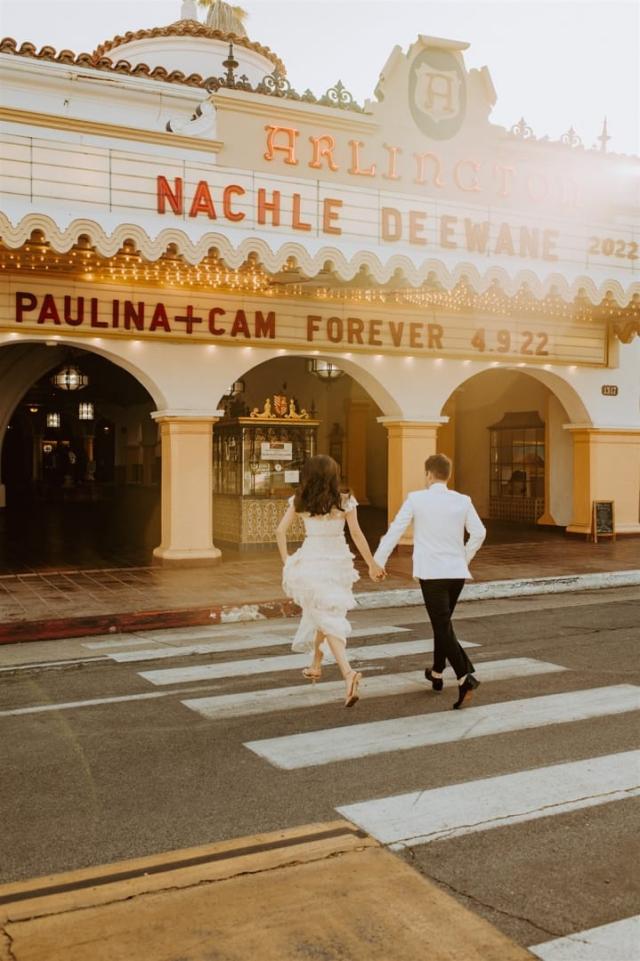 Bride and groom crossing the road to the Arlington Theatre for Paulina & Cam’s Wedding