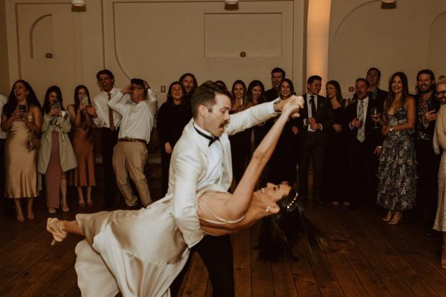 Groom dips bride on dance floor for Paulina & Cam’s Wedding