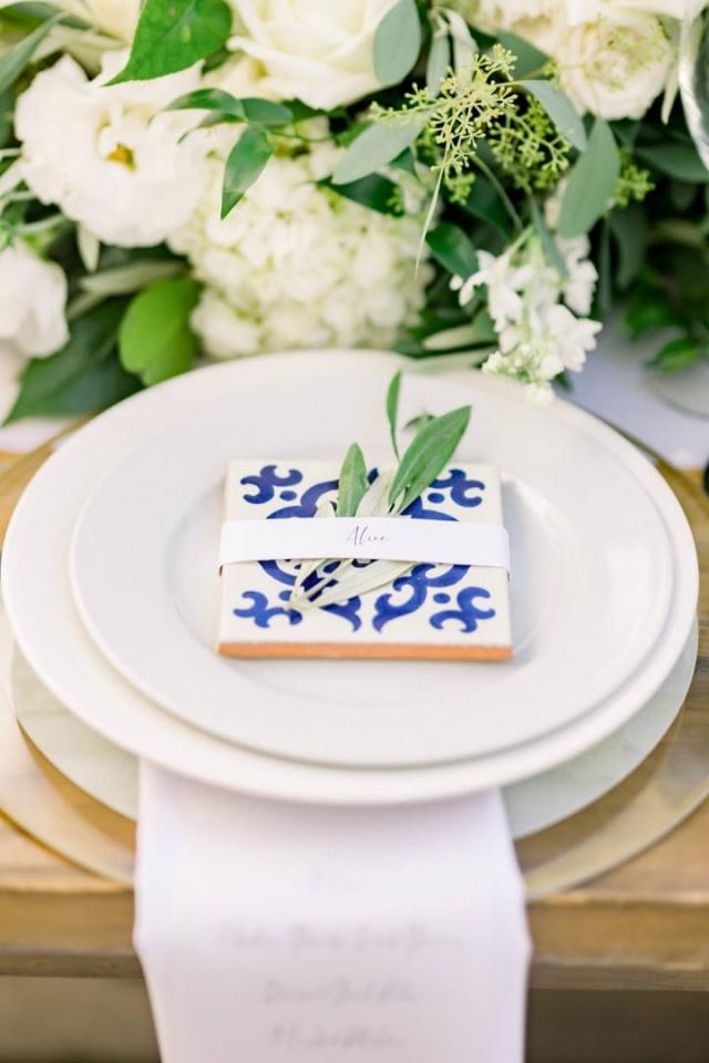 Clude view of place set with wrapped tile on plate for Sara & James’ Wedding
