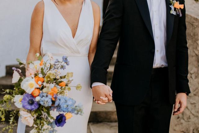 Mid shot of bride and groom holding hands for Veronica & Jake’s Wedding