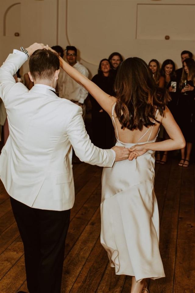 Back view of bride and groom dancing for Paulina & Cam’s Wedding