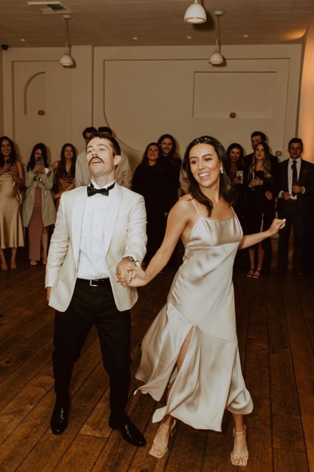 Front view of bride and groom dancing for Paulina & Cam’s Wedding