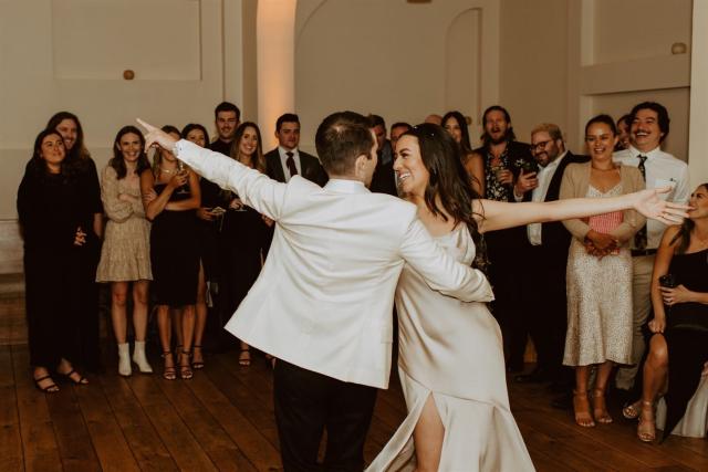 Bride and groom circling on dance floor for Paulina & Cam’s Wedding