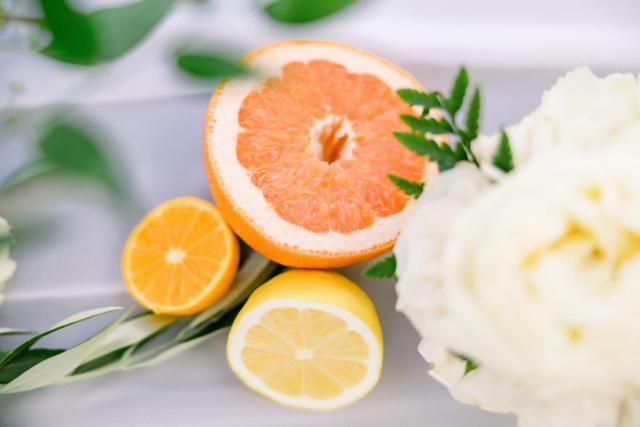 Clode view of cut lemon, orange, and grapefruit for Sara & James’ Wedding