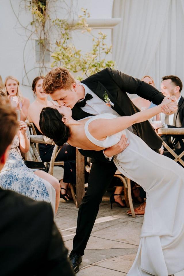 Groom dipping bride on the dance floor for Veronica & Jake’s Wedding