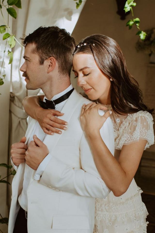 Bride holding groom from behind for Paulina & Cam’s Wedding