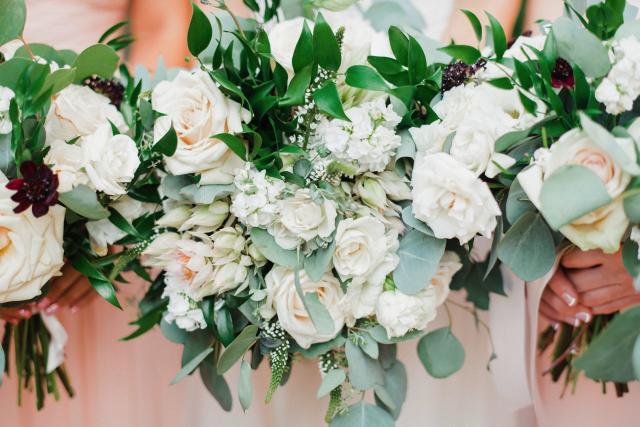 Wedding bouquet of white roses and green leaves for Jennifer & Lars' Wedding