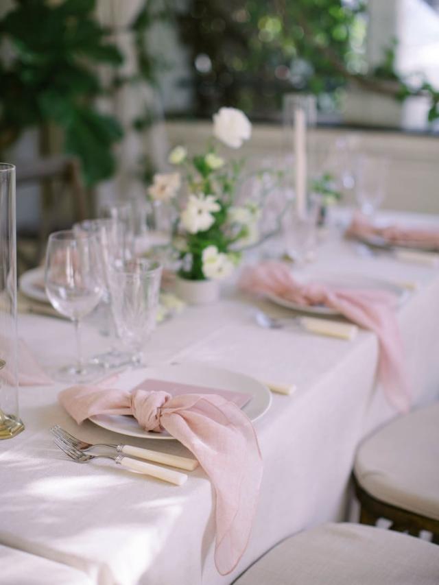 Mid view of placemat with flowers and pink napkins for Jammie & Duncan's Wedding