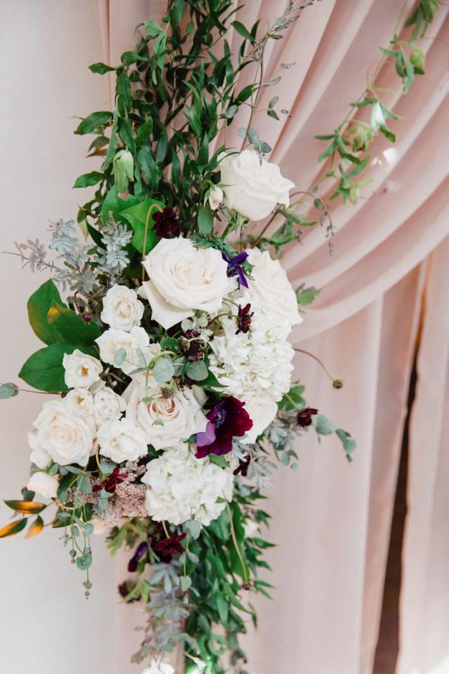 Bouquet of flowers on a curtain for Jennifer & Lars' Wedding